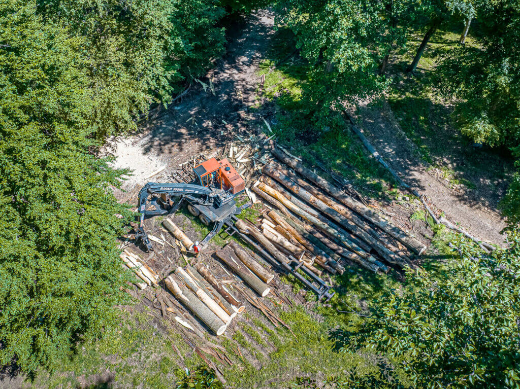 aerial view of logs stacked at a loading area