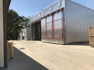 feature image of blog showing a large wood kiln with an open door